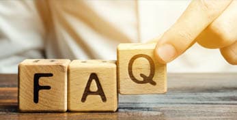 "Hand placing wooden blocks with letters F, A, Q to represent frequently asked questions about the new generation of hot peel film."