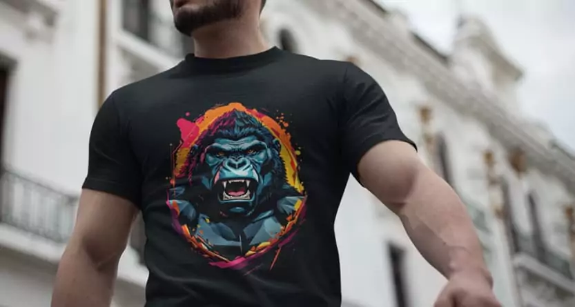 Man wearing a black tight-fitting T-shirt with a vibrant DTF print of a roaring gorilla