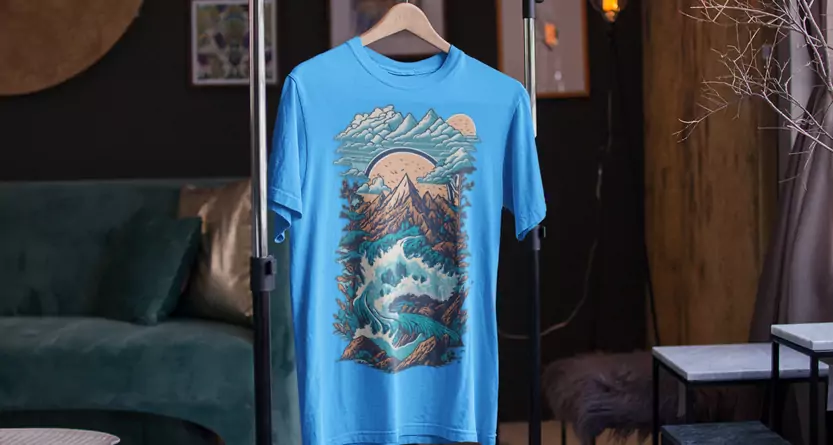 Blue T-Shirt with DTF transfer depicting a river, mountain, and sky