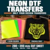 Solid yellow, green, pink and orange neon DTF sheets beside a black T-shirt with a neon yellow tiger print.